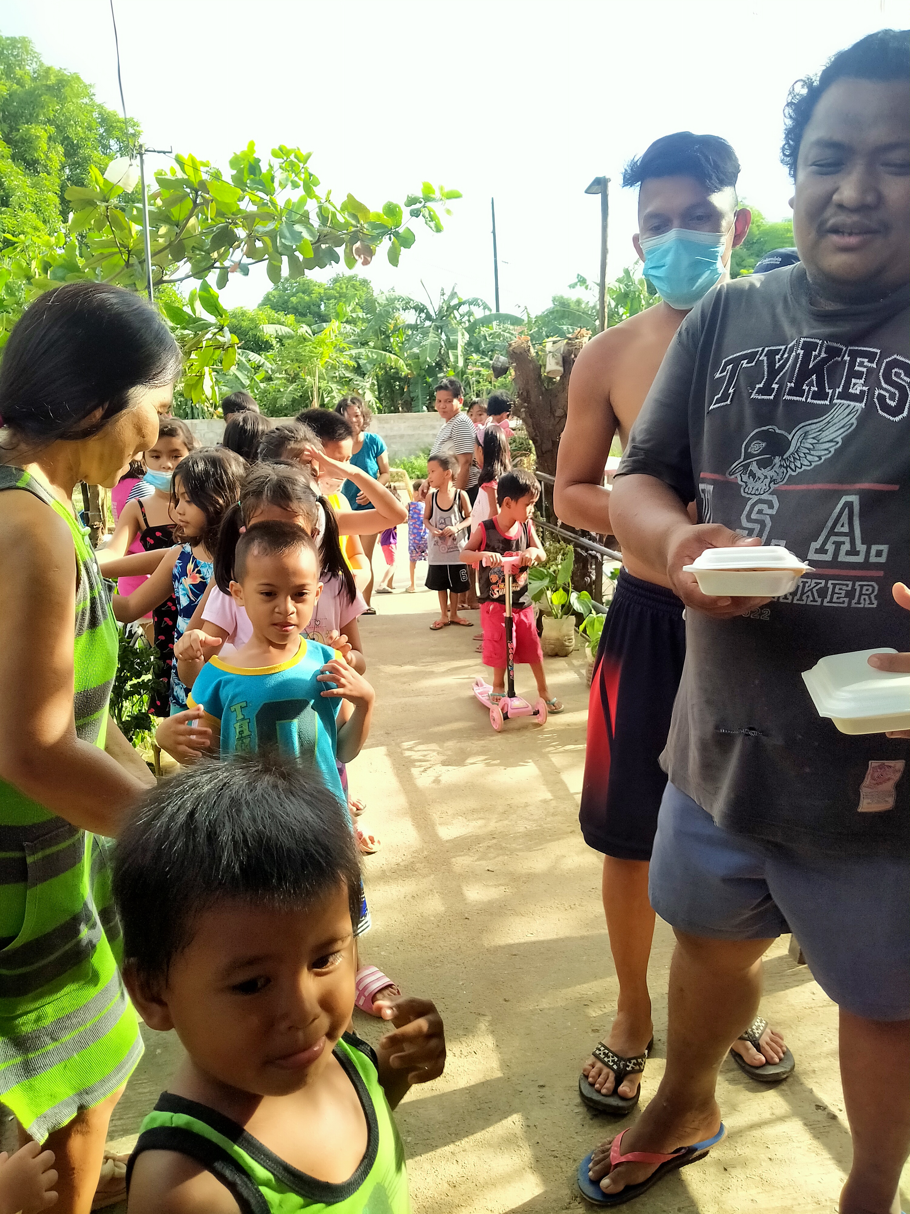 A.G. AIZO - "With hands stretched out to help and serve, Avocadians and volunteers organized a community feeding activity for the children of Brgy. Ampid, San Mateo, Rizal - filling empty stomachs and warming grateful hearts. "